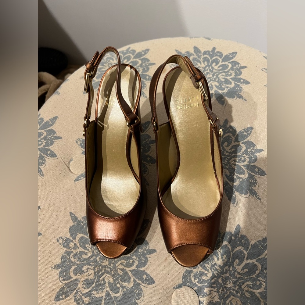 Stuart Weitzman bronze peep toe heels.